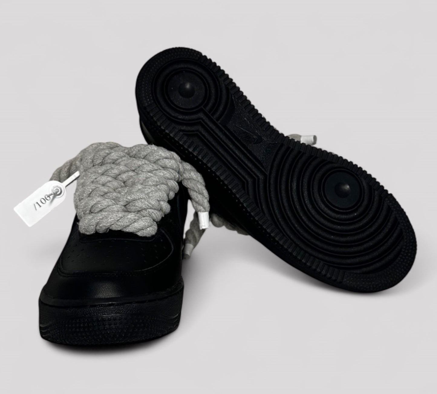 Sole detail of Nike AF1 sneakers with rope laces