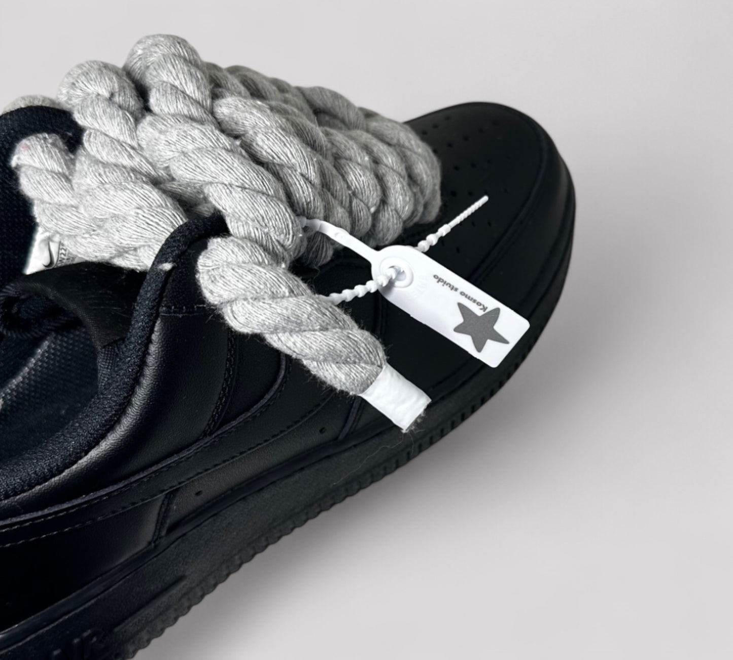 Detail of Kosmo studio tag on Nike AF1 rope laces