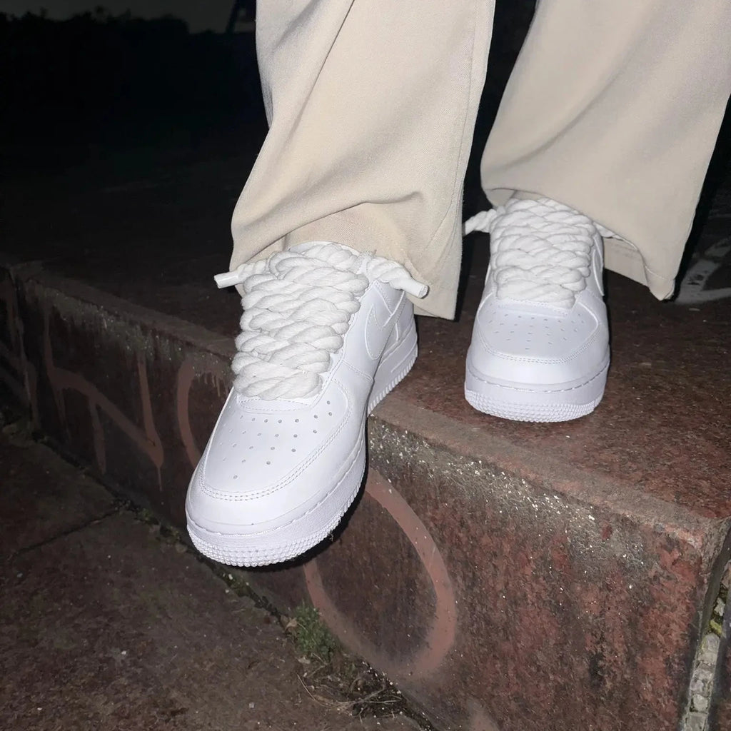 Nike Air Force 1 white with custom rope laces on brick steps