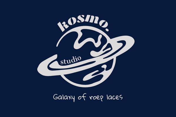 White kosmo studio logo on dark blue background 