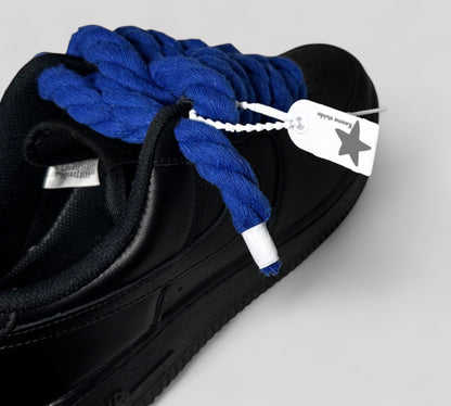 Kosmo studio brand tag on black Nike AF1 