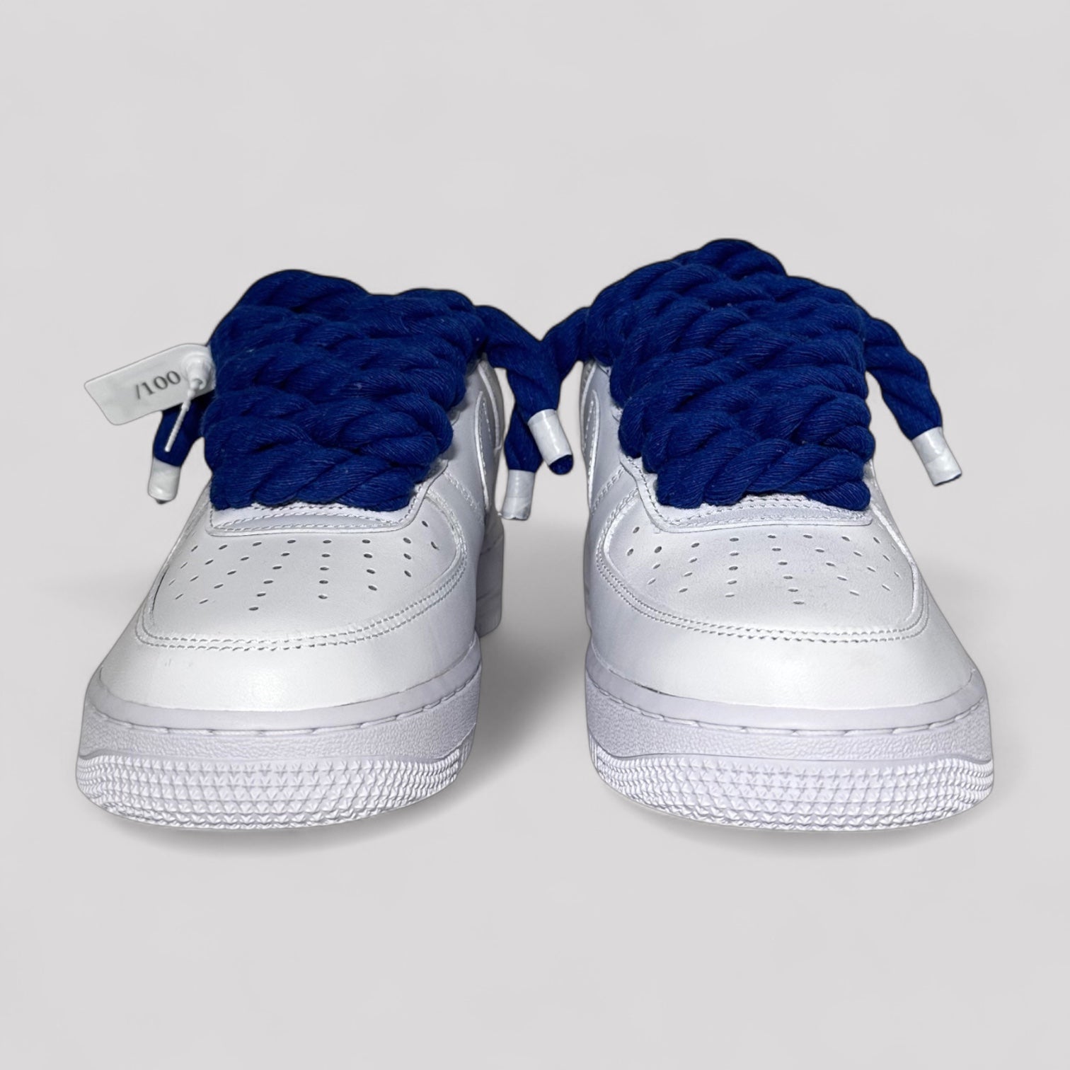 Custom white Nike Air Force 1 navy blue rope laces front view pair