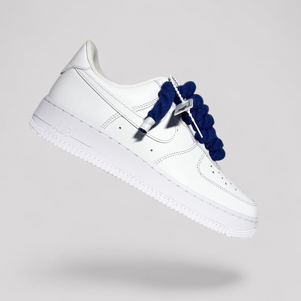 Custom white Nike Air Force 1 navy blue rope laces floating side view