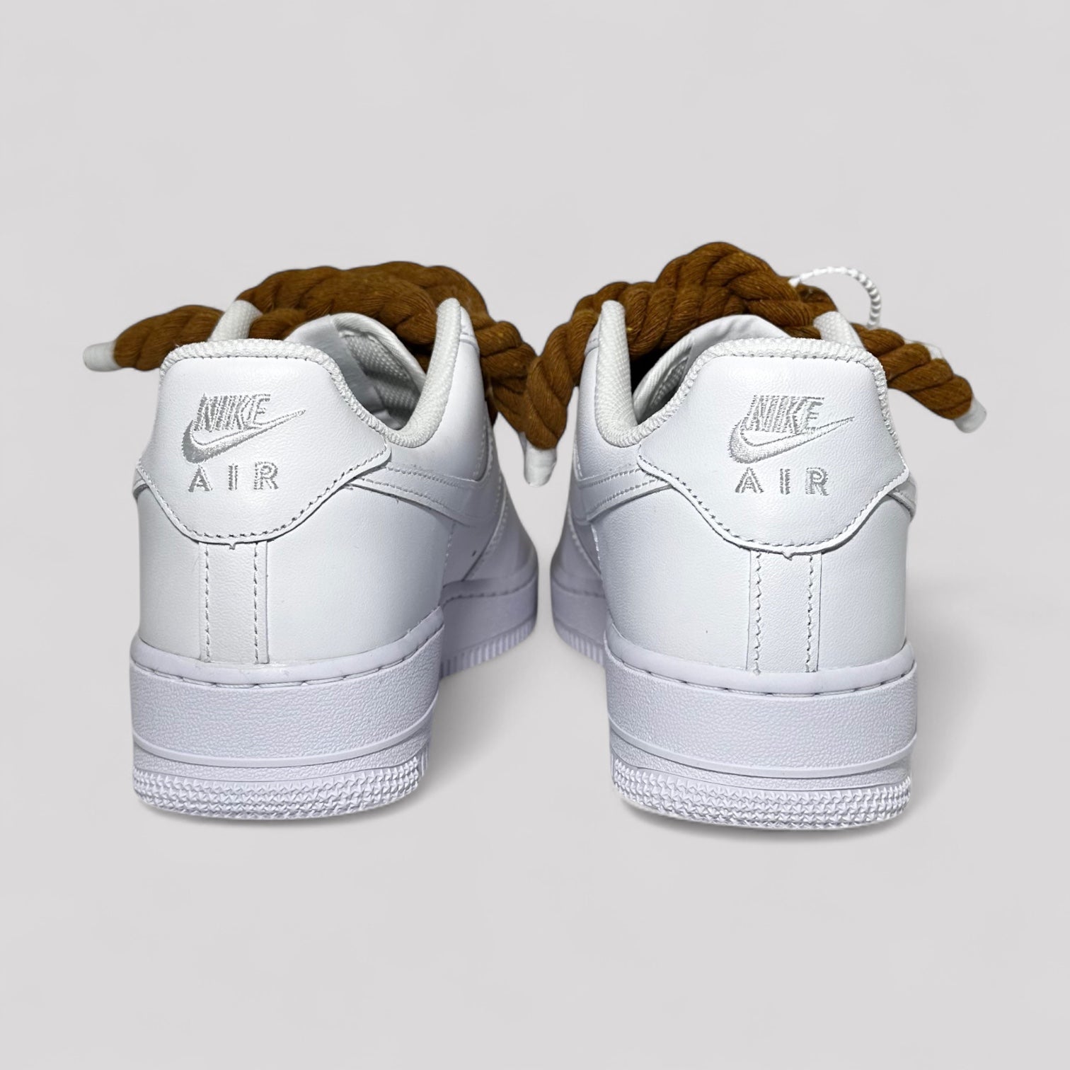 Custom white Nike Air Force 1 brown rope laces back view pair