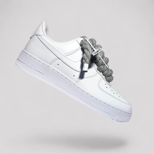 Nike Air Force 1 white with grey rope laces side floating product photo