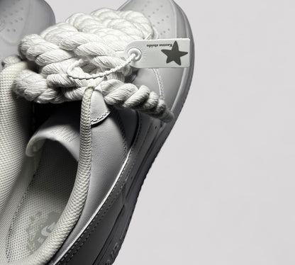 Kosmo studio tag detail on Nike air force 1 rope laces