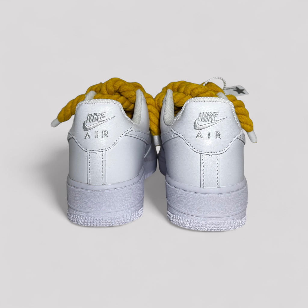 Nike Air Force 1 white with yellow rope laces back view both shoes product photo