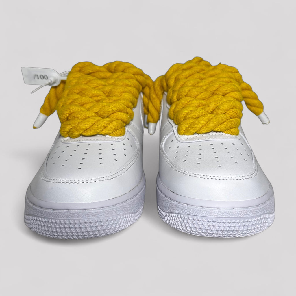 Nike Air Force 1 white with yellow rope laces front view both shoes product photo