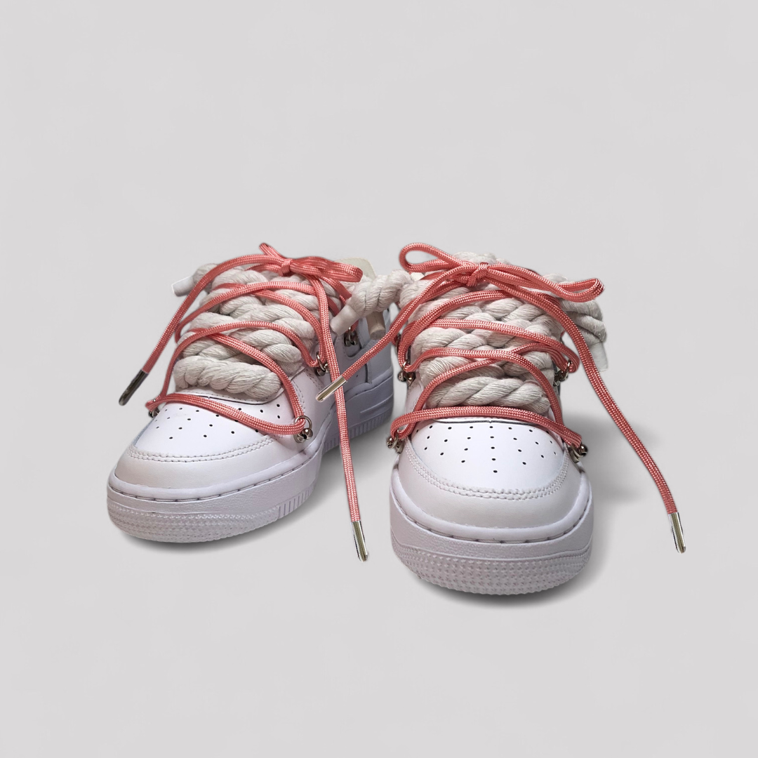 White nike air force 1 rope laces with pink over laces on white background
