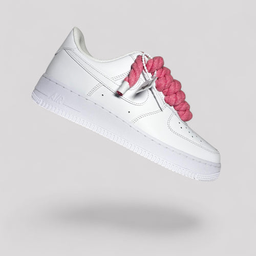 Nike Air Force 1 white with pink rope laces floating dynamic product shot