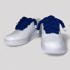 Custom white Nike Air Force 1 navy blue rope laces angled side view pair